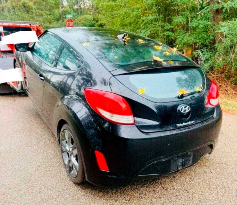 Junk car being towed for cash in Cleveland, TX, showing same-day pickup service by local buyers.