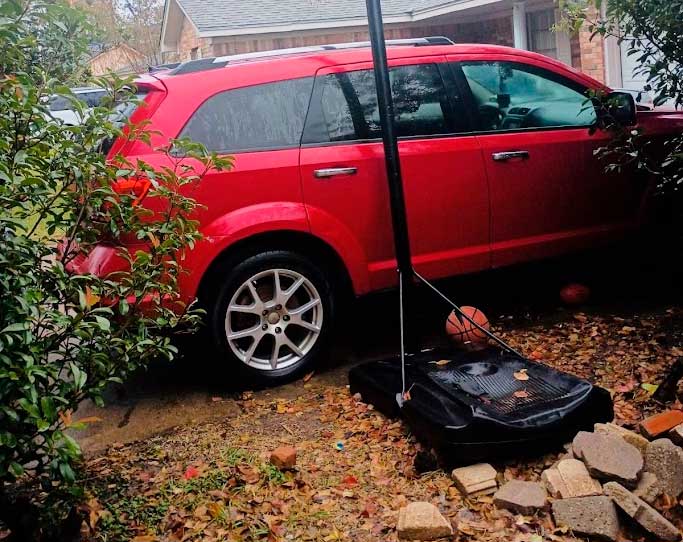 Burgandy Dodge Journey purchased for cash by Junk Car Buyers R-Us in Katy Texas driveway